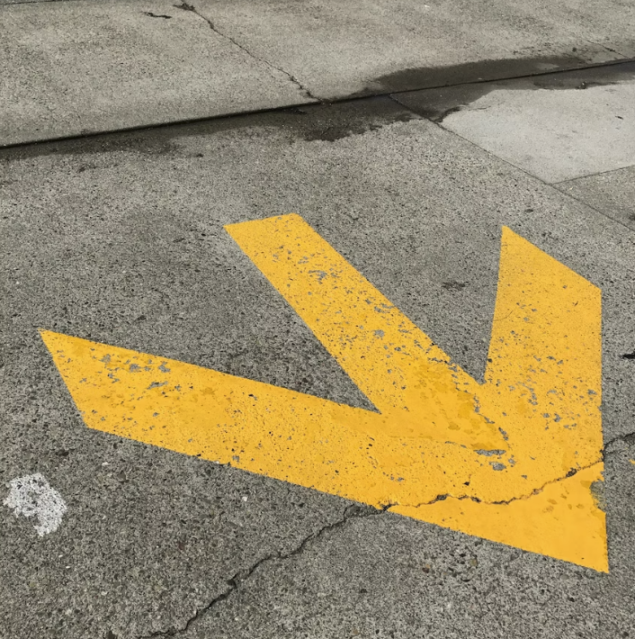 yellow road marking arrow