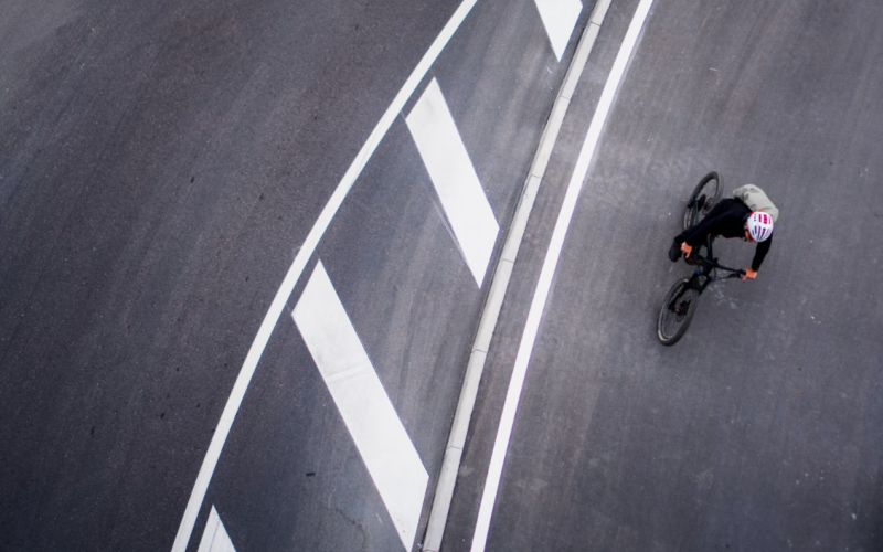 man cycling and road markings
